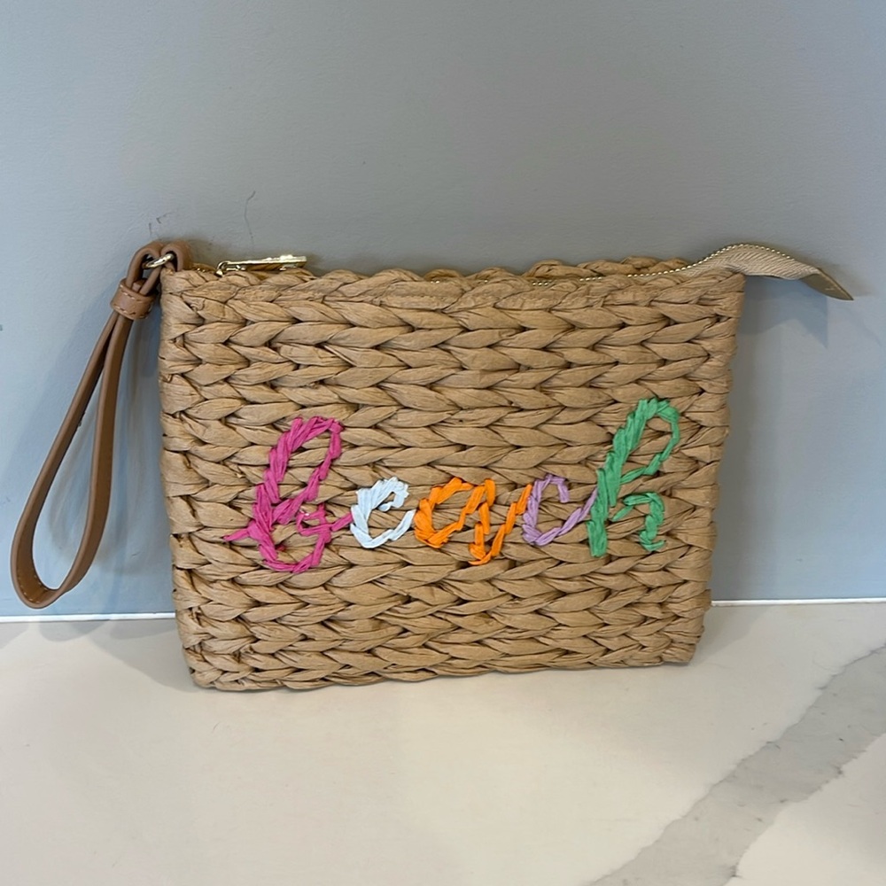 Beach purse with wrist strap.
